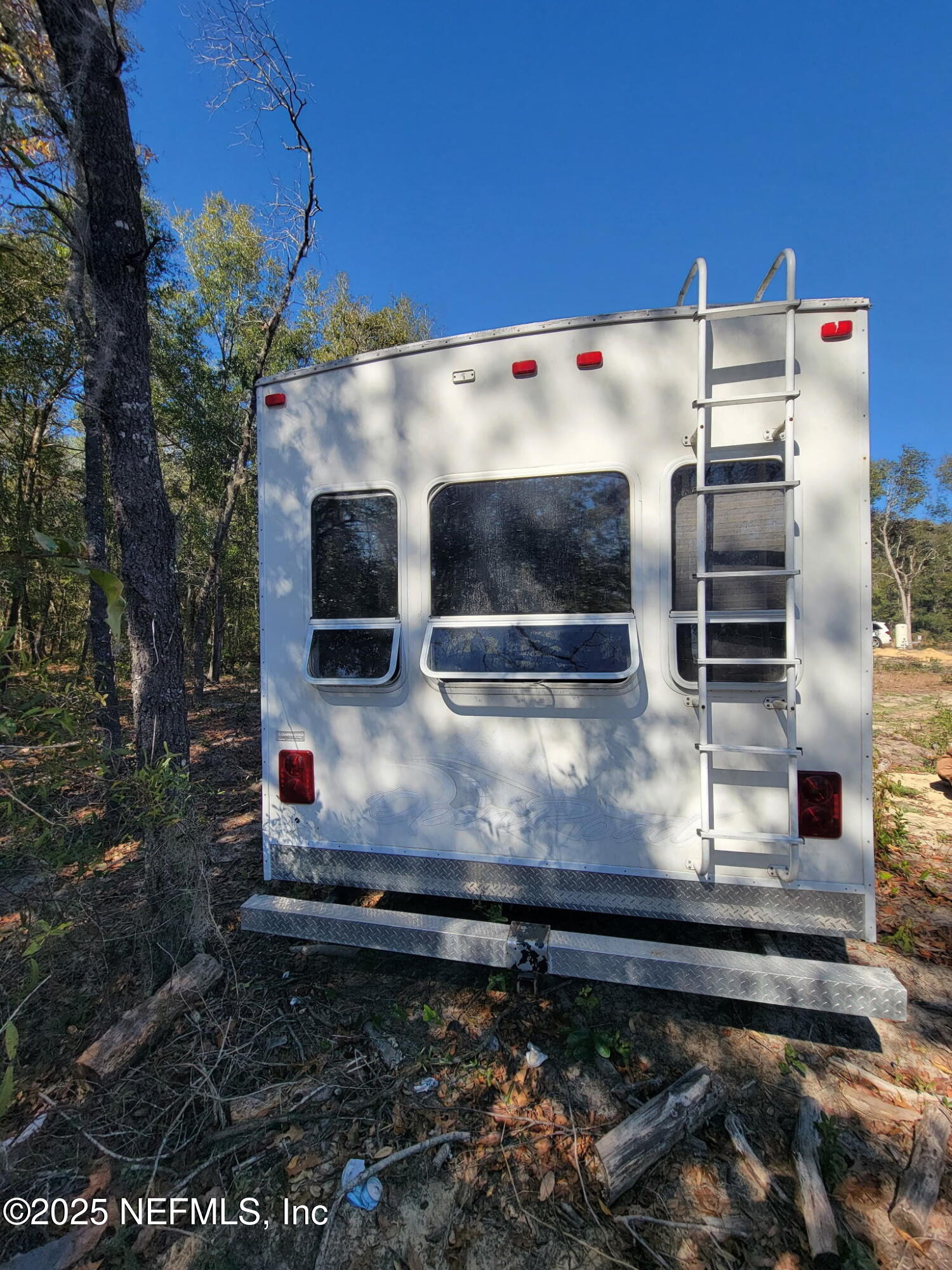 333 2nd Way Interlachen, FL 32148 - Photo 6 of 13 a kitchen with kitchen island a stove and a microwave