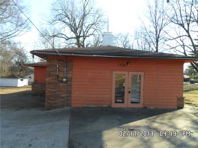 1135 Winchester Road Memphis, TN 38116 - Photo 3 of 7 a front view of a house with a yard
