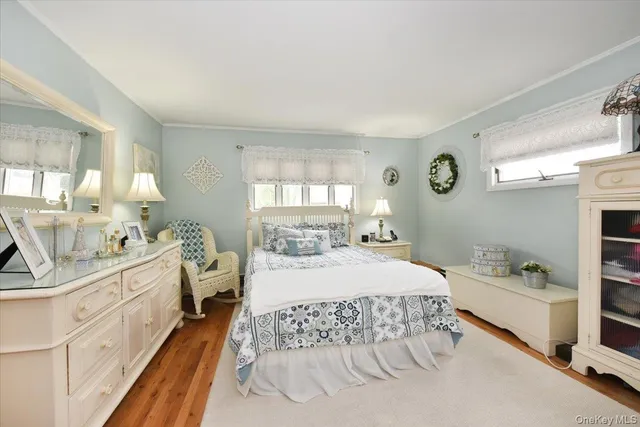 a room with a bed and a large window