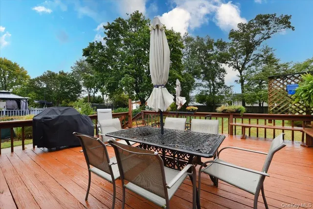 a view of a chairs and table on the deck