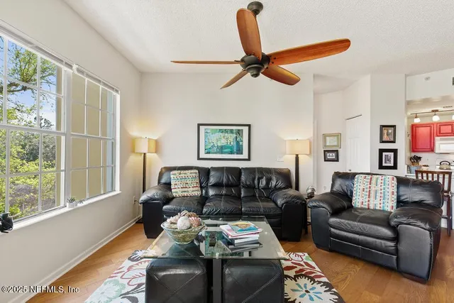 a kitchen with stainless steel appliances granite countertop a refrigerator and microwave