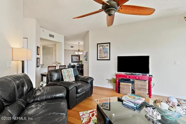 a kitchen with stainless steel appliances granite countertop a sink and a refrigerator