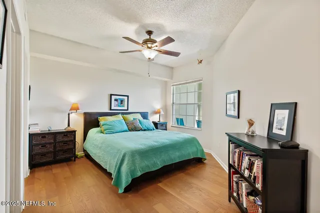 a bathroom with a sink vanity mirror and shower