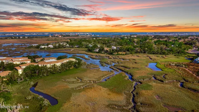 front view of a brick house with a yard