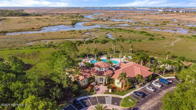a large kitchen with granite countertop a sink and a refrigerator
