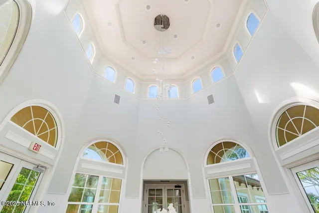 a room with gym equipment and a large window