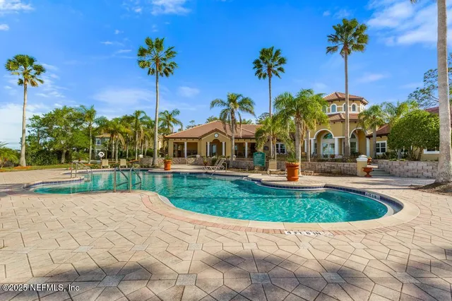 a view of a a dining room with furniture window and outside view