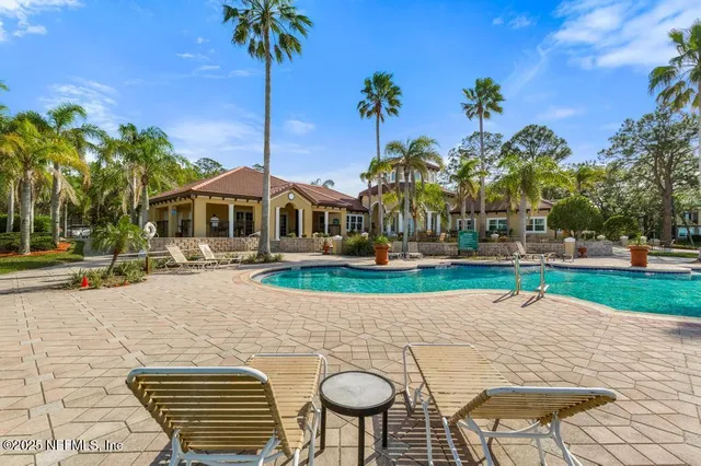 a view of a park with large trees