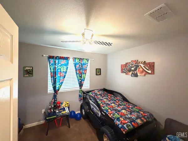 a bedroom with furniture and a window