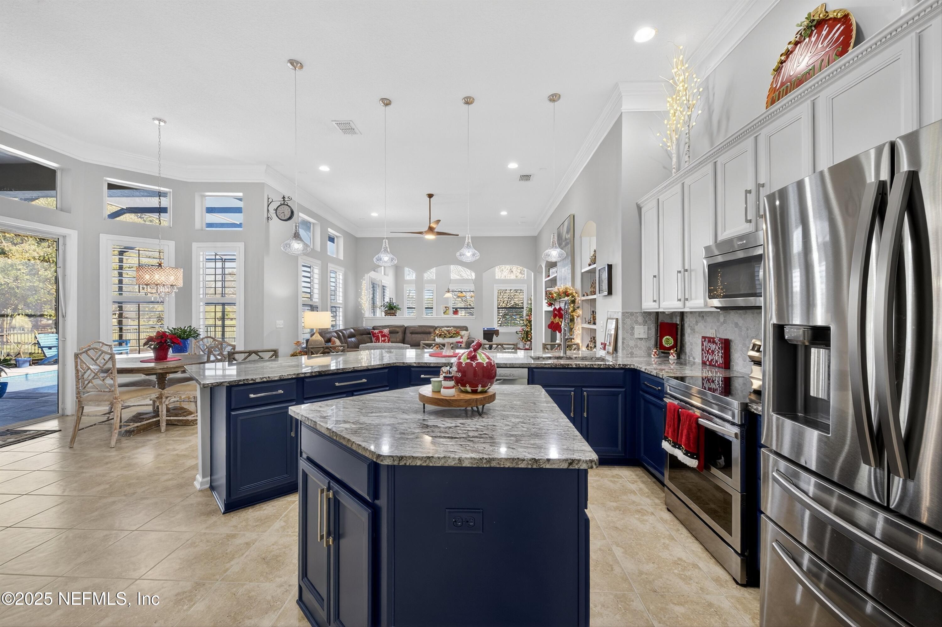 1104 Westfield Way St. Augustine, FL 32095 - Photo 19 of 53 a kitchen with stainless steel appliances granite countertop a refrigerator a stove top oven a sink and dishwasher