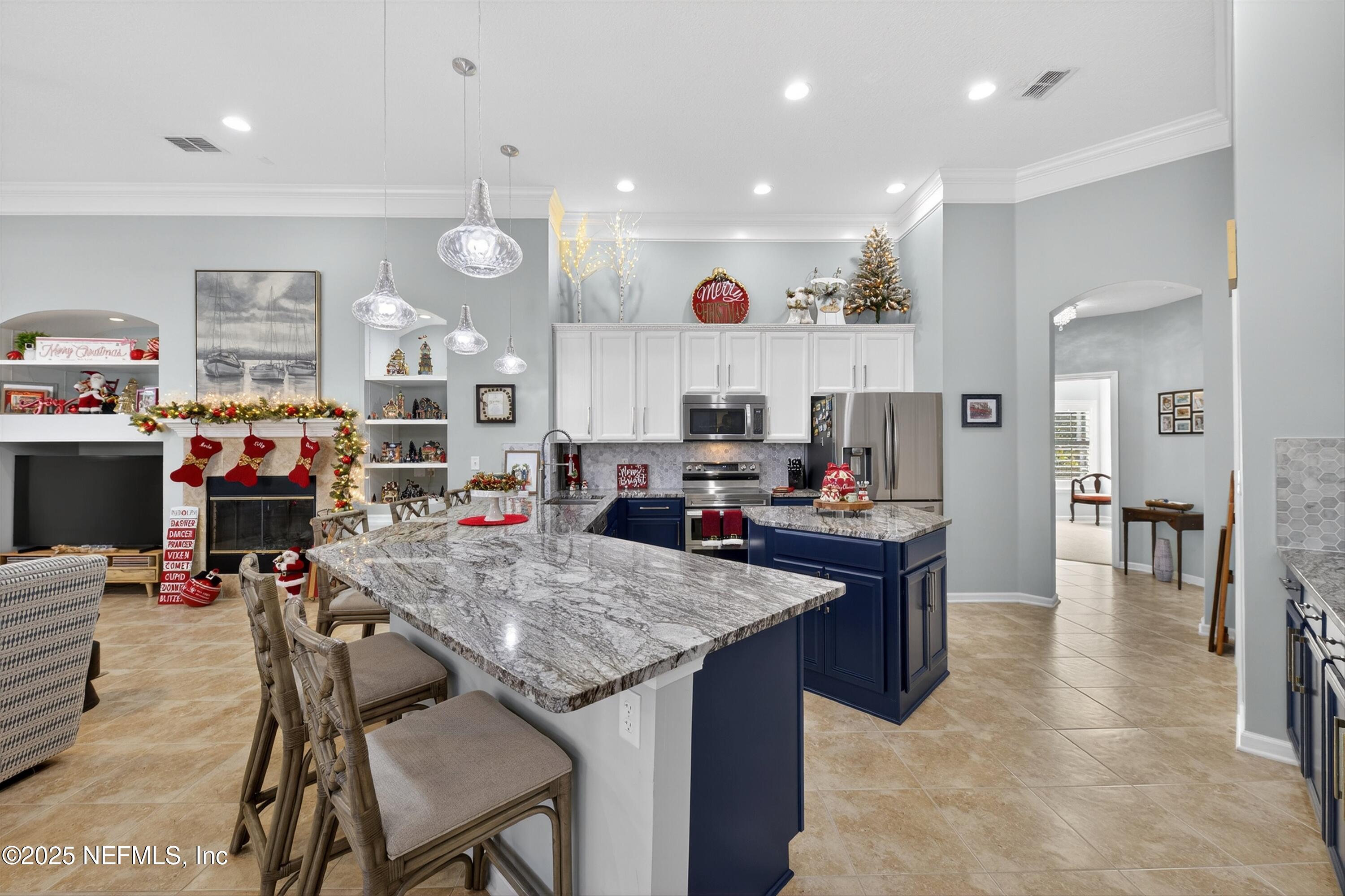 1104 Westfield Way St. Augustine, FL 32095 - Photo 21 of 53 a kitchen view with stainless steel appliances lots of counter space dining table and chairs