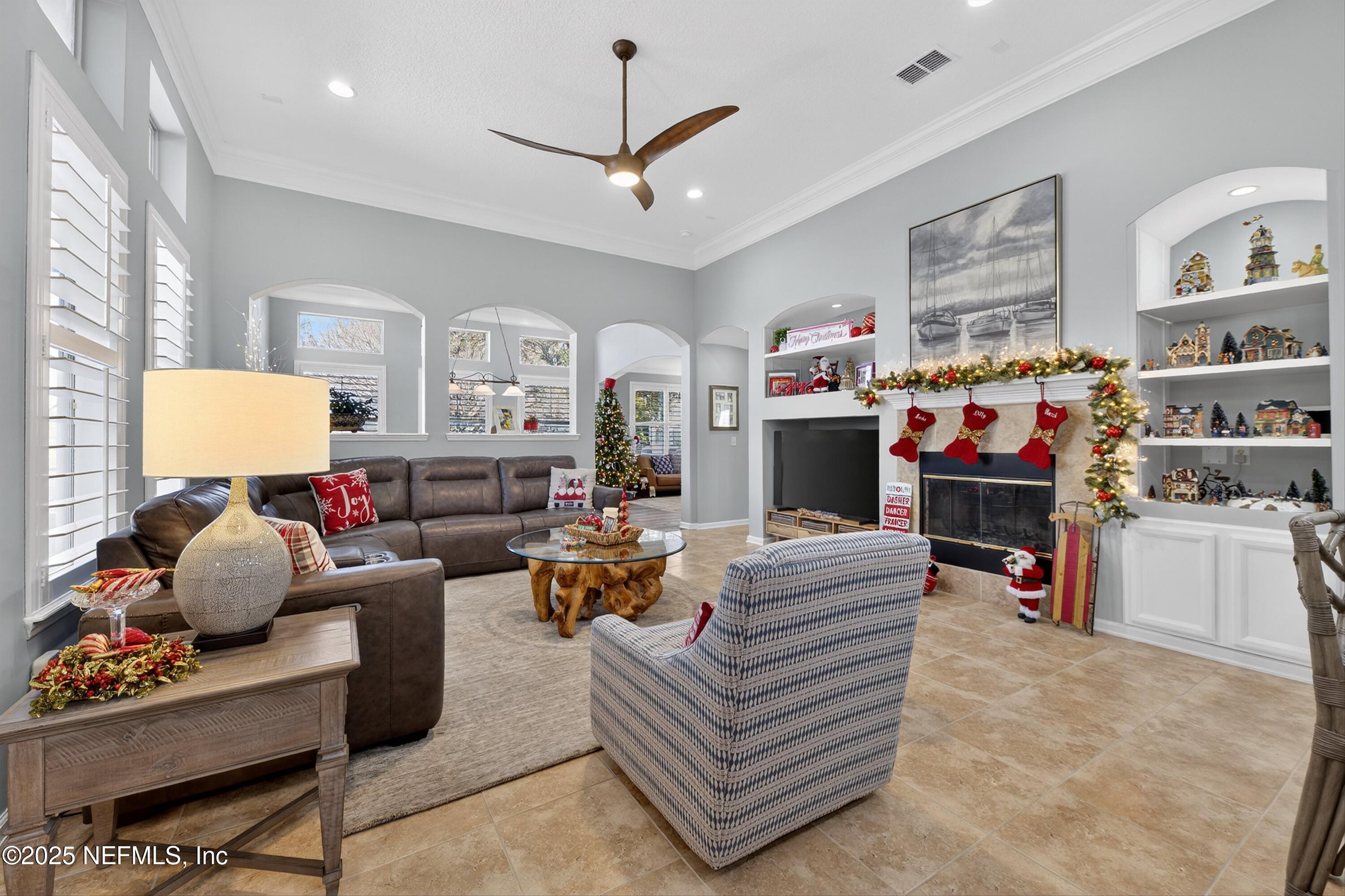 1104 Westfield Way St. Augustine, FL 32095 - Photo 26 of 53 a living room with furniture a rug and a ceiling fan