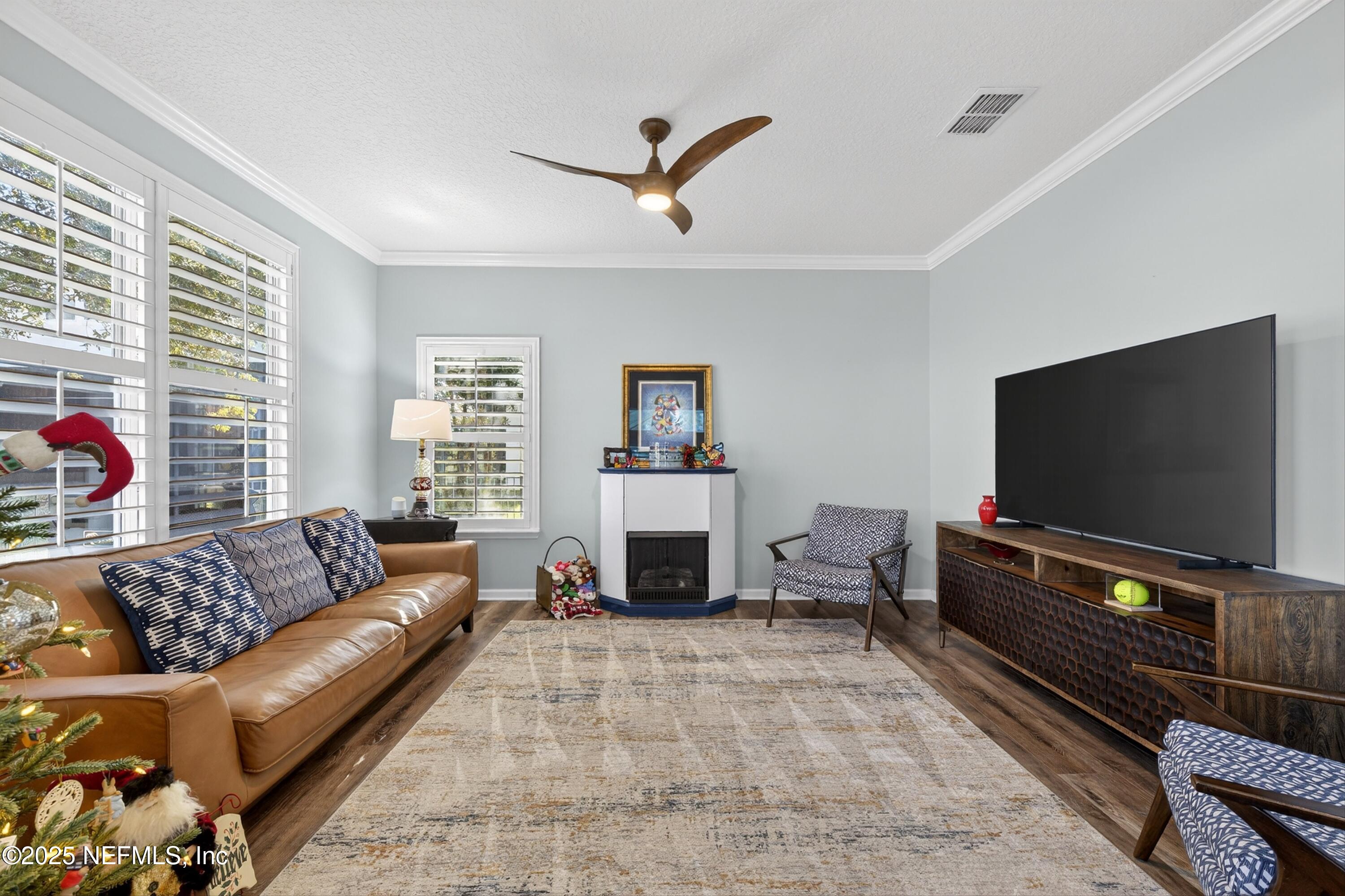 1104 Westfield Way St. Augustine, FL 32095 - Photo 31 of 53 a living room with furniture and a flat screen tv