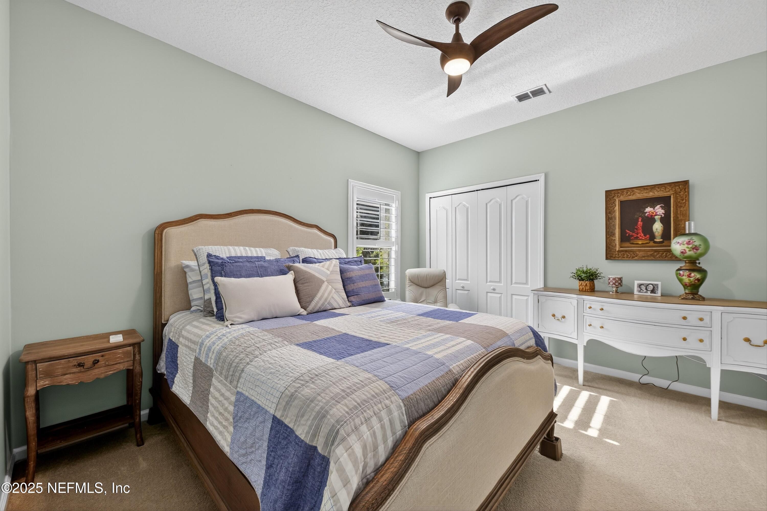 1104 Westfield Way St. Augustine, FL 32095 - Photo 32 of 53 a bedroom with a bed and a dresser