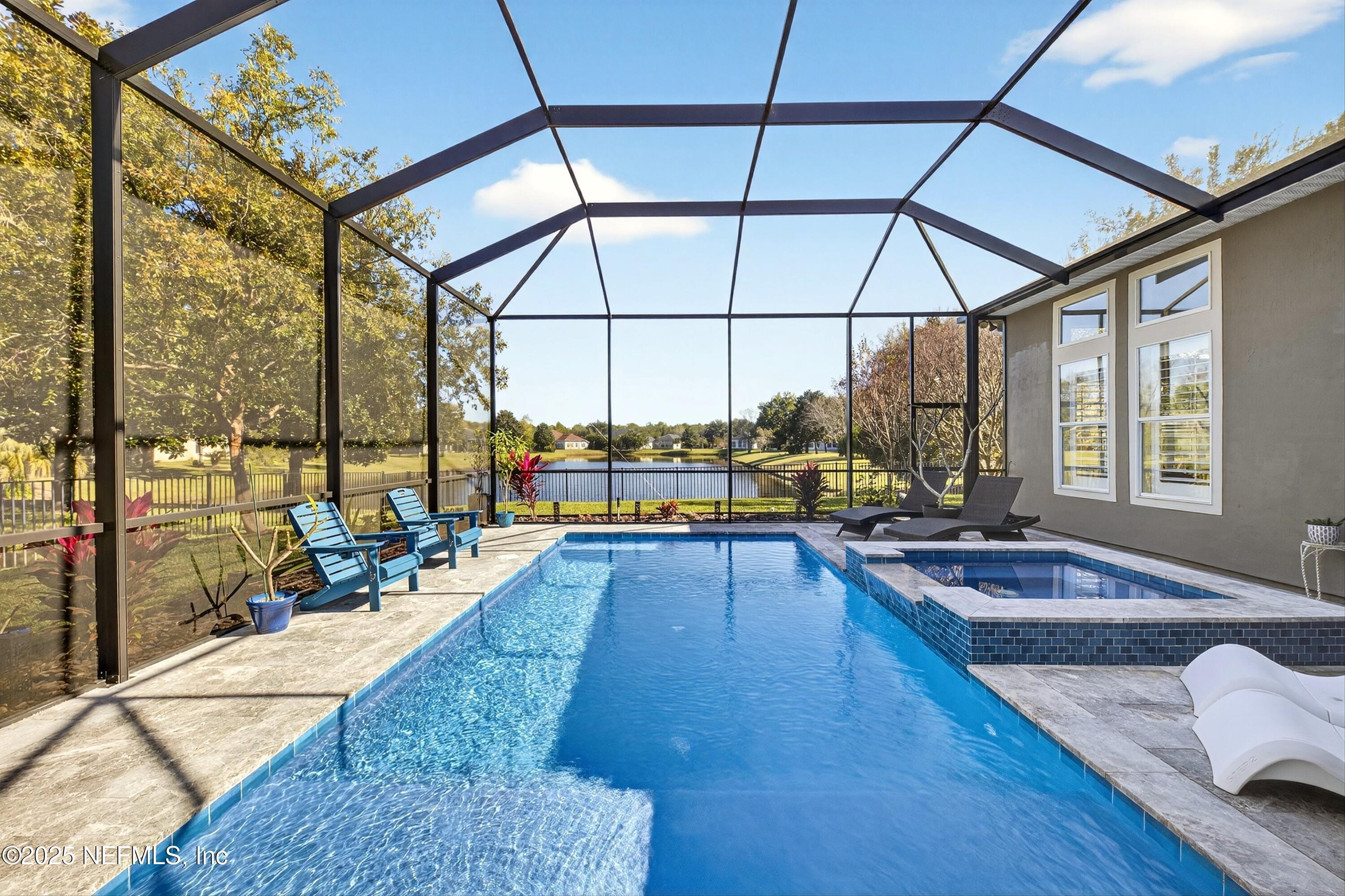 1104 Westfield Way St. Augustine, FL 32095 - Photo 37 of 53 a swimming pool with outdoor seating and yard