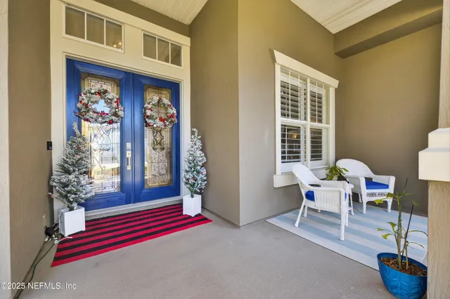 a dining room with furniture and a window