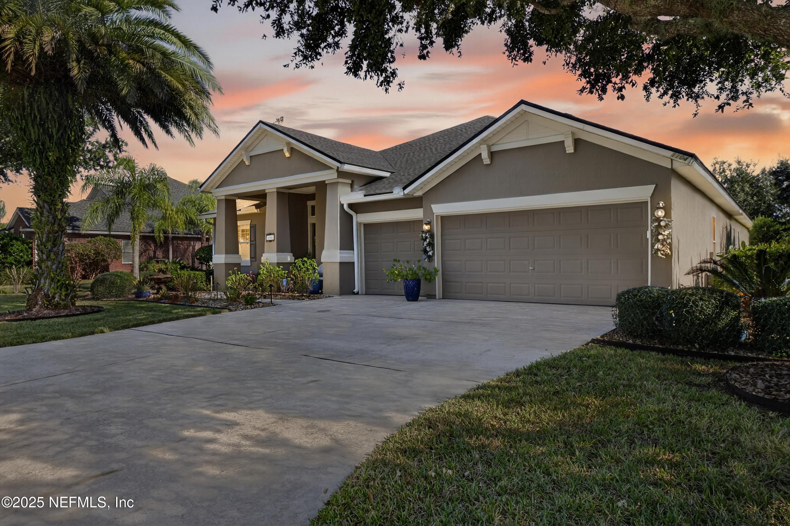 1104 Westfield Way St. Augustine, FL 32095 - Photo 44 of 53 a front view of a house with a garden