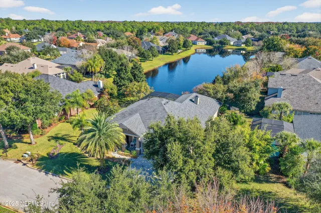 an aerial view of a house with a garden