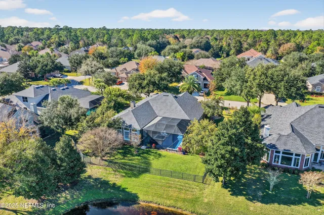 an aerial view of a house with a garden
