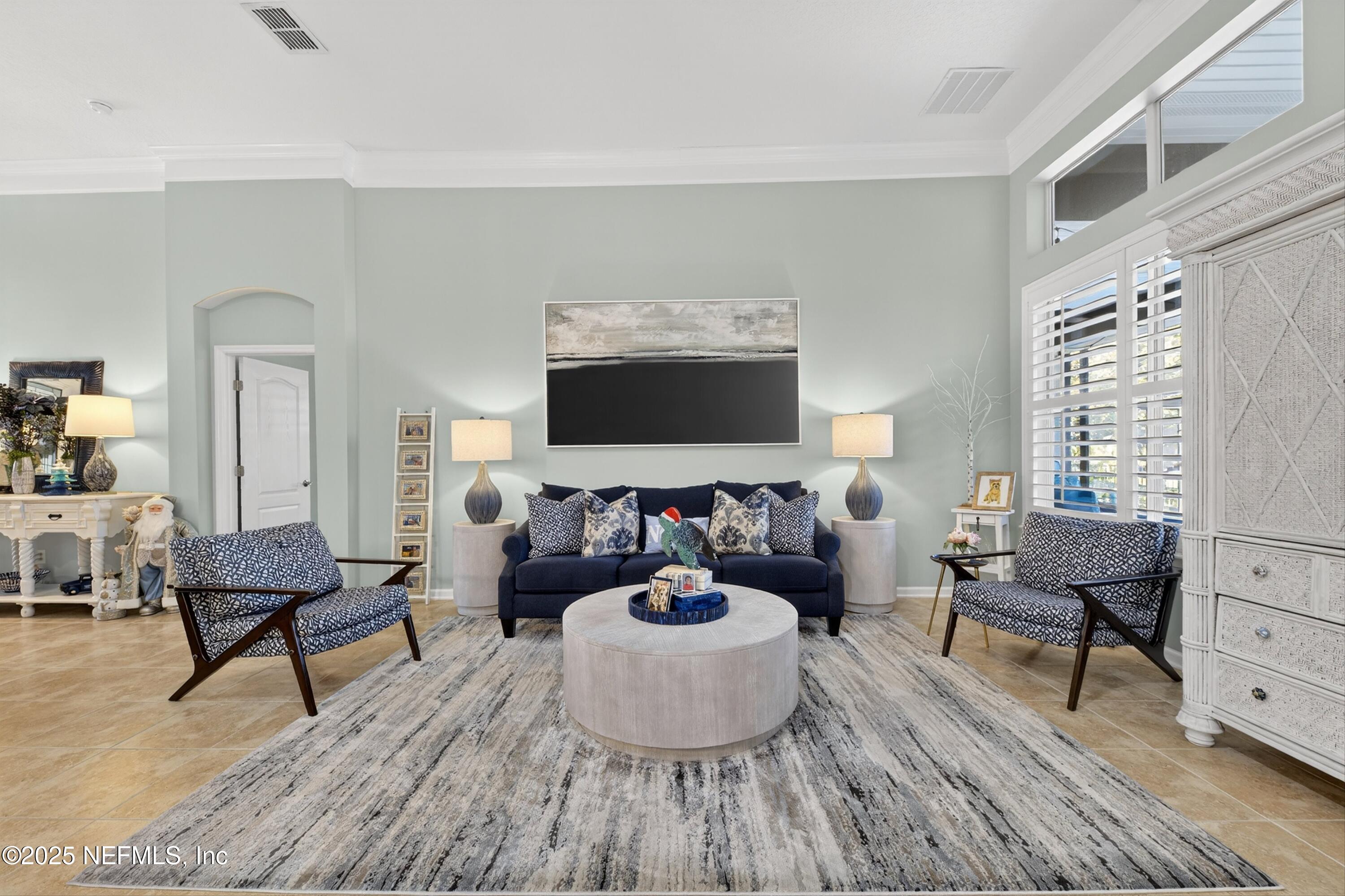 1104 Westfield Way St. Augustine, FL 32095 - Photo 10 of 53 a living room with furniture and a flat screen tv