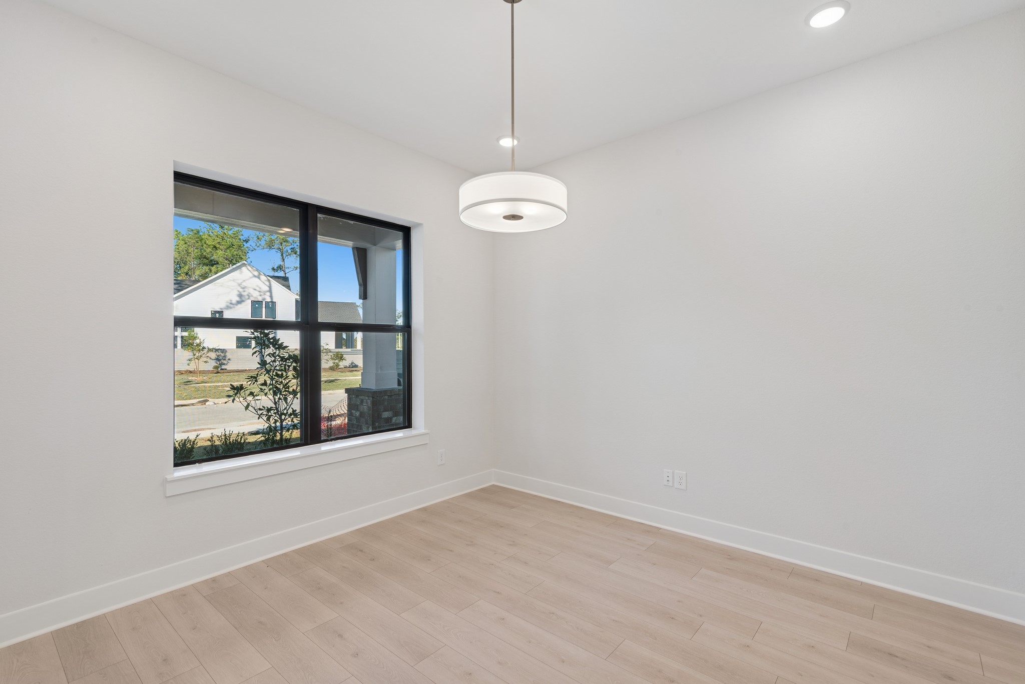 16146 Rita Road Conroe, TX 77302 - Photo 14 of 49 an empty room with windows and outdoor view