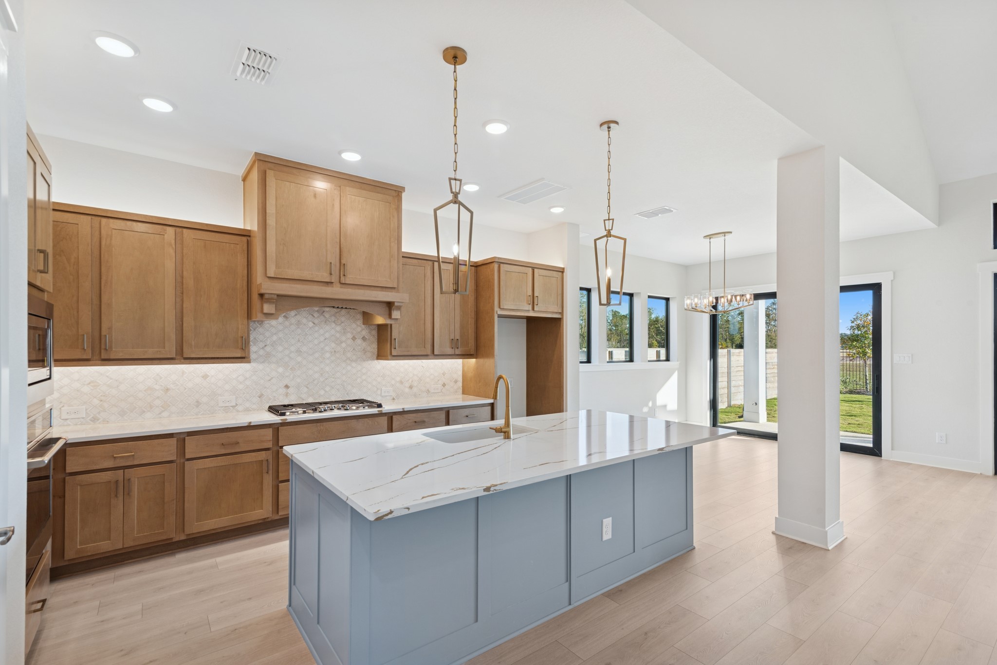16146 Rita Road Conroe, TX 77302 - Photo 19 of 49 a kitchen with stainless steel appliances granite countertop a sink a stove and a refrigerator