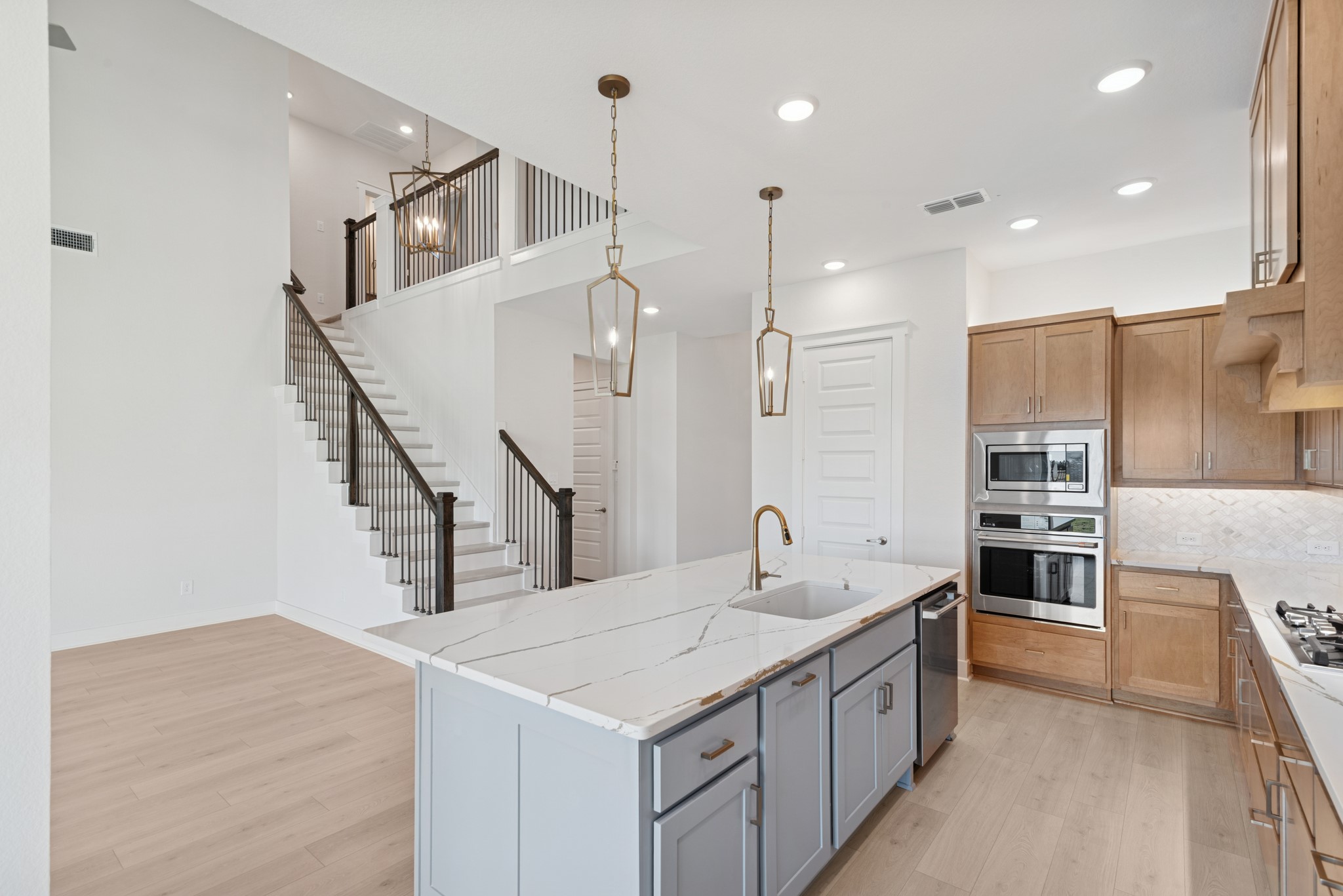 16146 Rita Road Conroe, TX 77302 - Photo 23 of 49 a kitchen with kitchen island a sink appliances and a counter top space