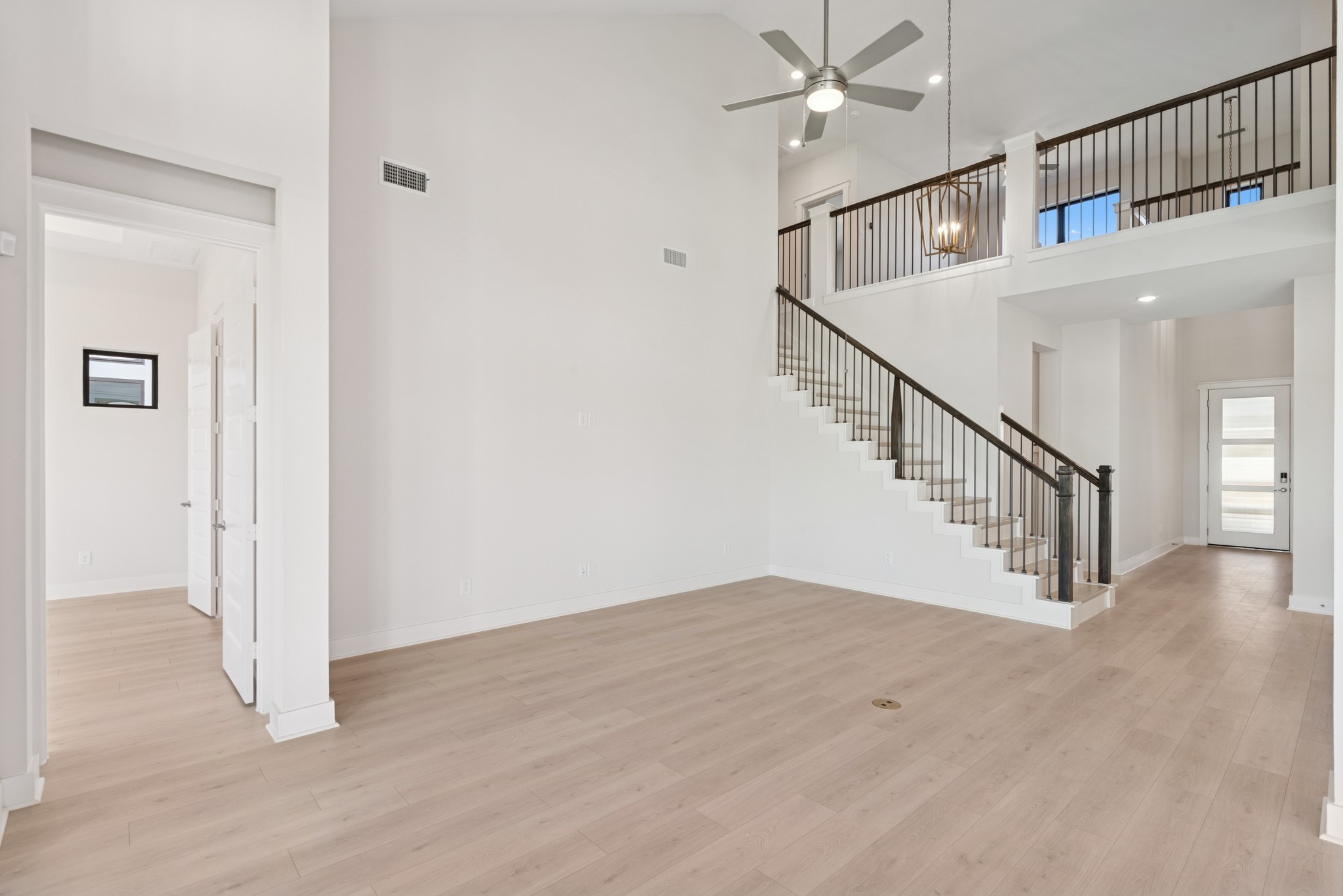 16146 Rita Road Conroe, TX 77302 - Photo 26 of 49 a view of entryway and hall with wooden floor