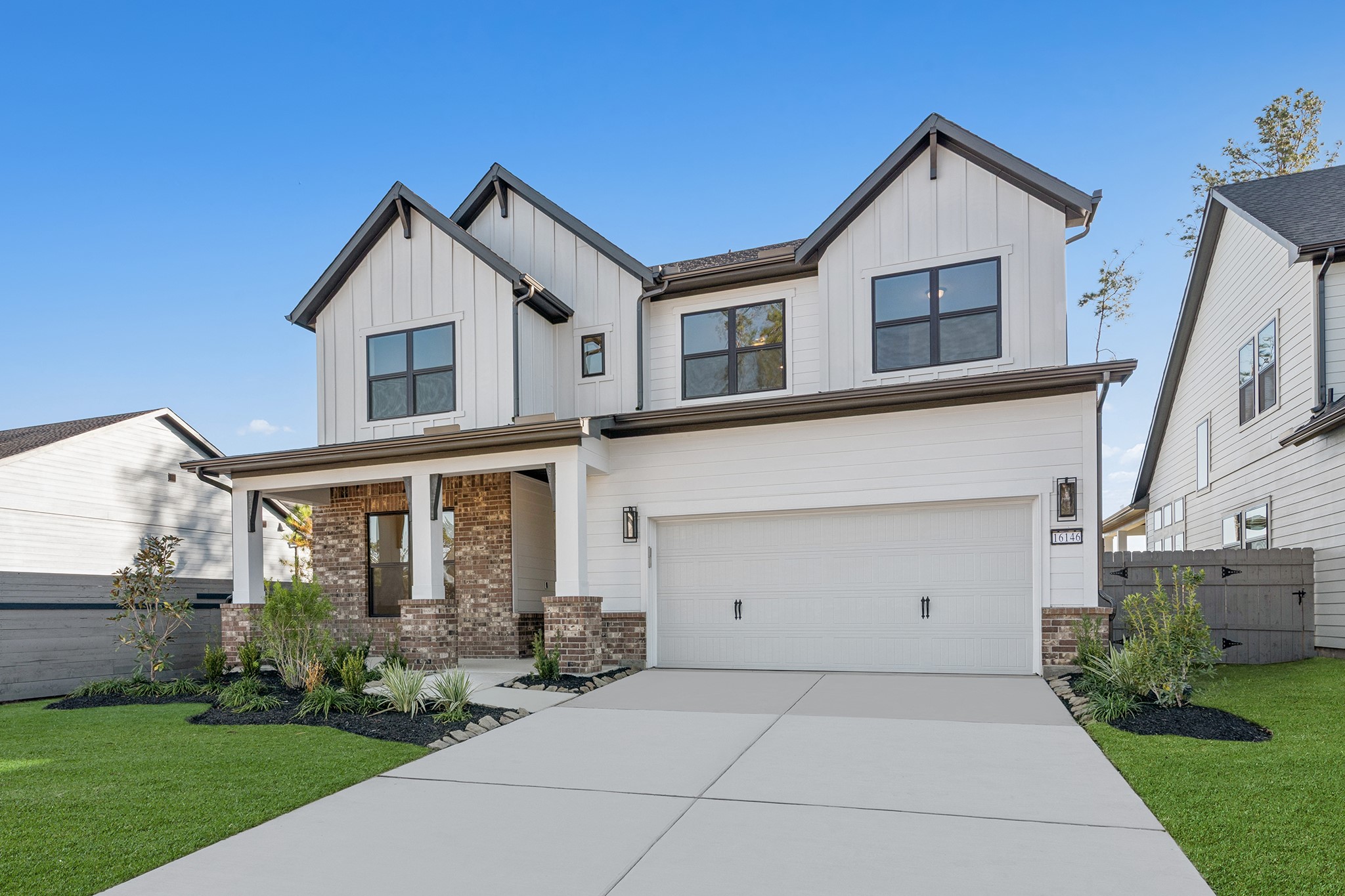 16146 Rita Road Conroe, TX 77302 - Photo 3 of 49 a front view of a house with a yard and garage