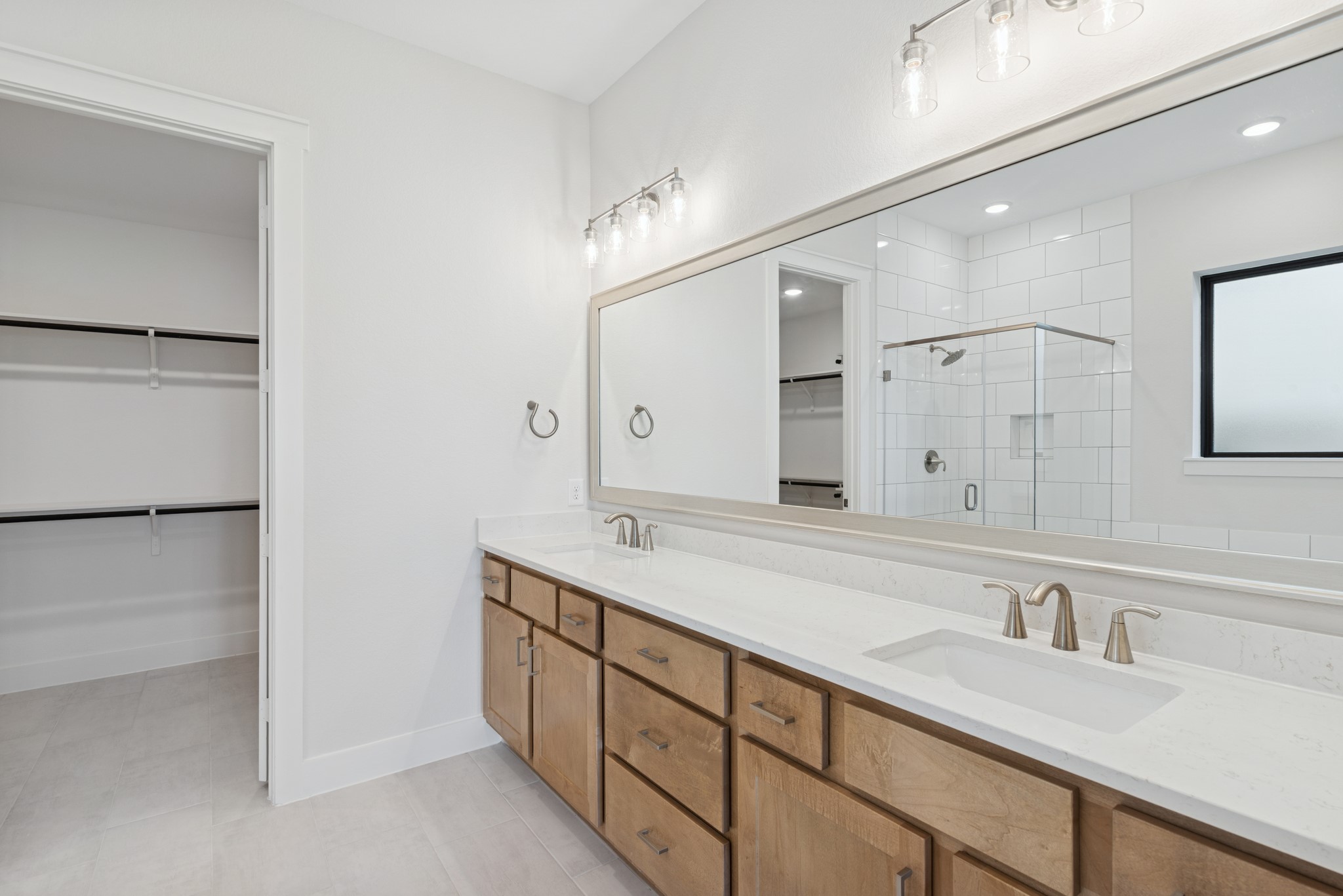 16146 Rita Road Conroe, TX 77302 - Photo 30 of 49 a spacious bathroom with a granite countertop sink mirror and double