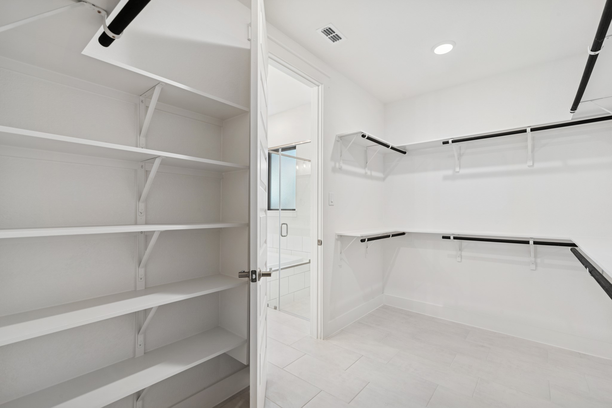 16146 Rita Road Conroe, TX 77302 - Photo 32 of 49 a view of an empty walk in closet