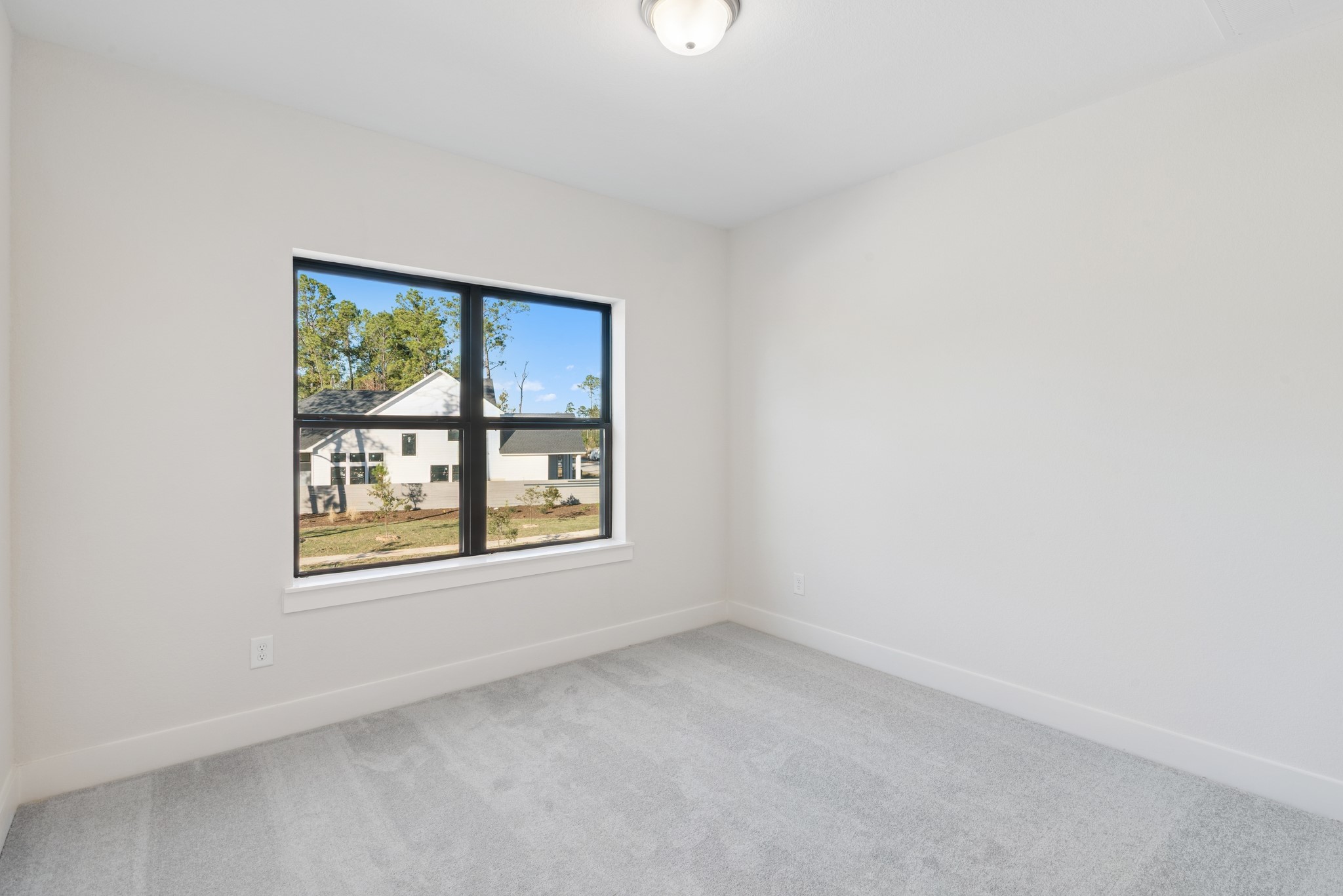 16146 Rita Road Conroe, TX 77302 - Photo 40 of 49 an empty room with a window