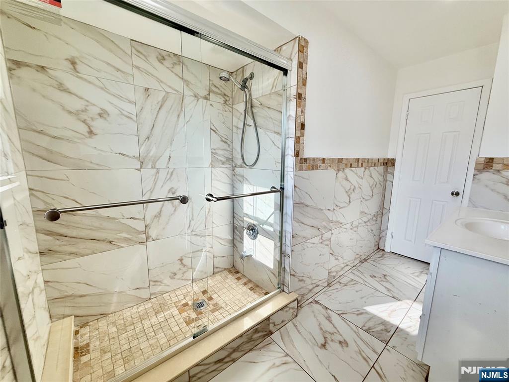 41 Corabelle Avenue, Unit 2 Lodi, NJ 07644 - Photo 15 of 21 a bathroom with a shower