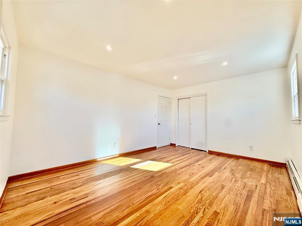 41 Corabelle Avenue, Unit 2 Lodi, NJ 07644 - Photo 17 of 21 a view of empty room with wooden floor