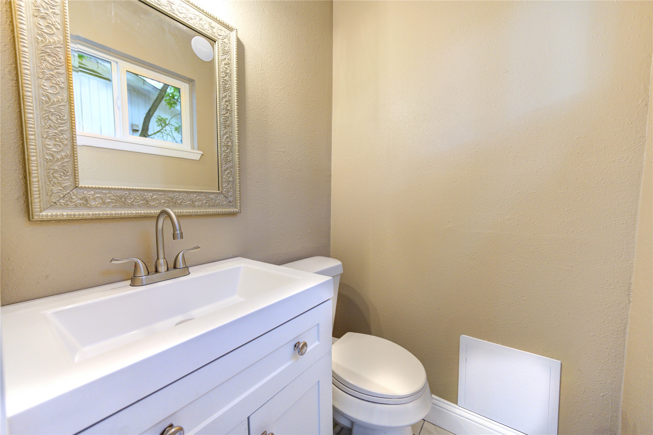 1921 Ripple Creek Drive Rosenberg, TX 77471 - Photo 12 of 17 a bathroom with a sink a toilet and mirror