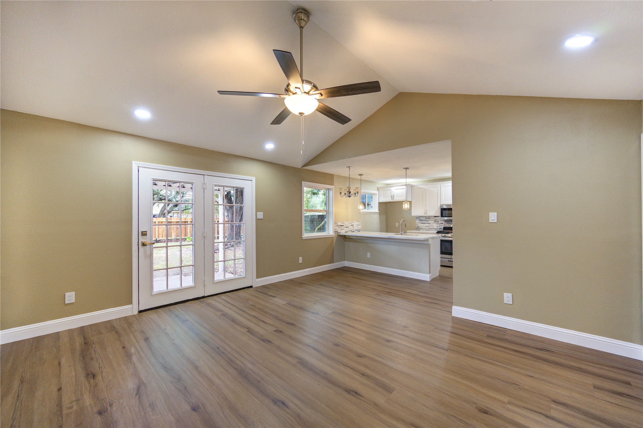1921 Ripple Creek Drive Rosenberg, TX 77471 - Photo 6 of 17 a view of an empty room with window and wooden floor