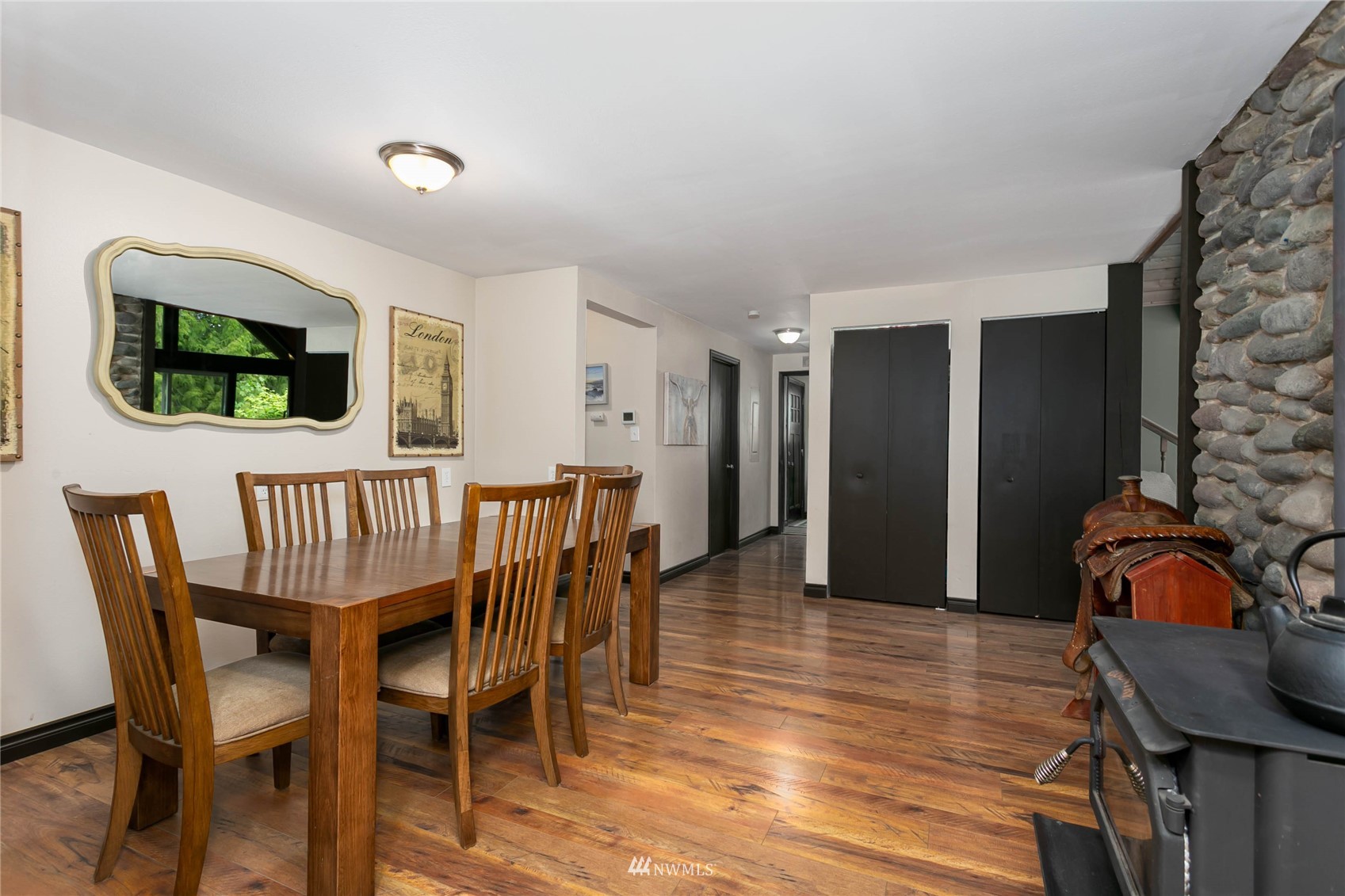 15722 240th Street East Graham, WA 98338 - Photo 13 of 40 a view of a dining room with furniture window and wooden floor