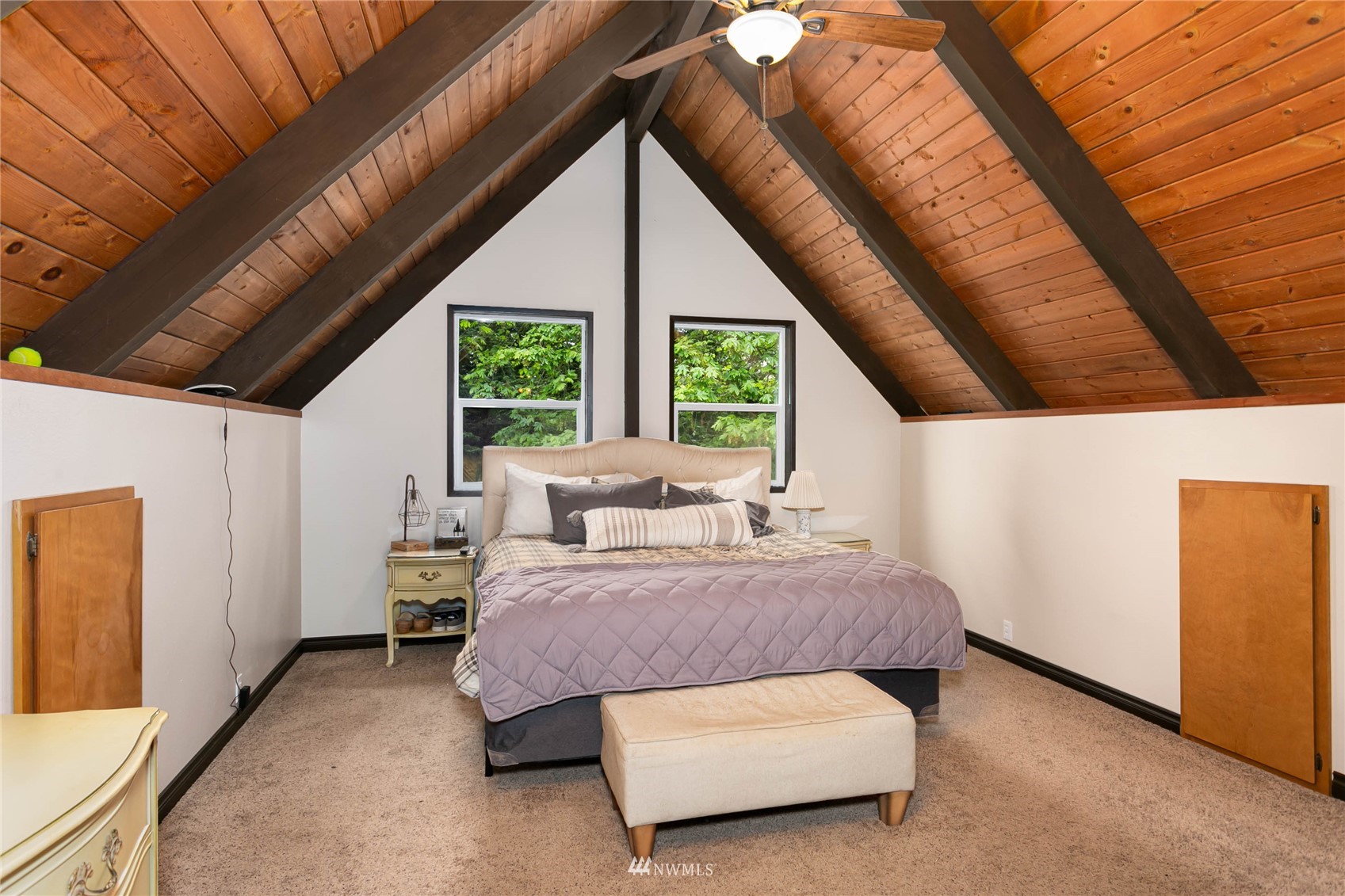 15722 240th Street East Graham, WA 98338 - Photo 17 of 40 a spacious bedroom with a bed and a large window