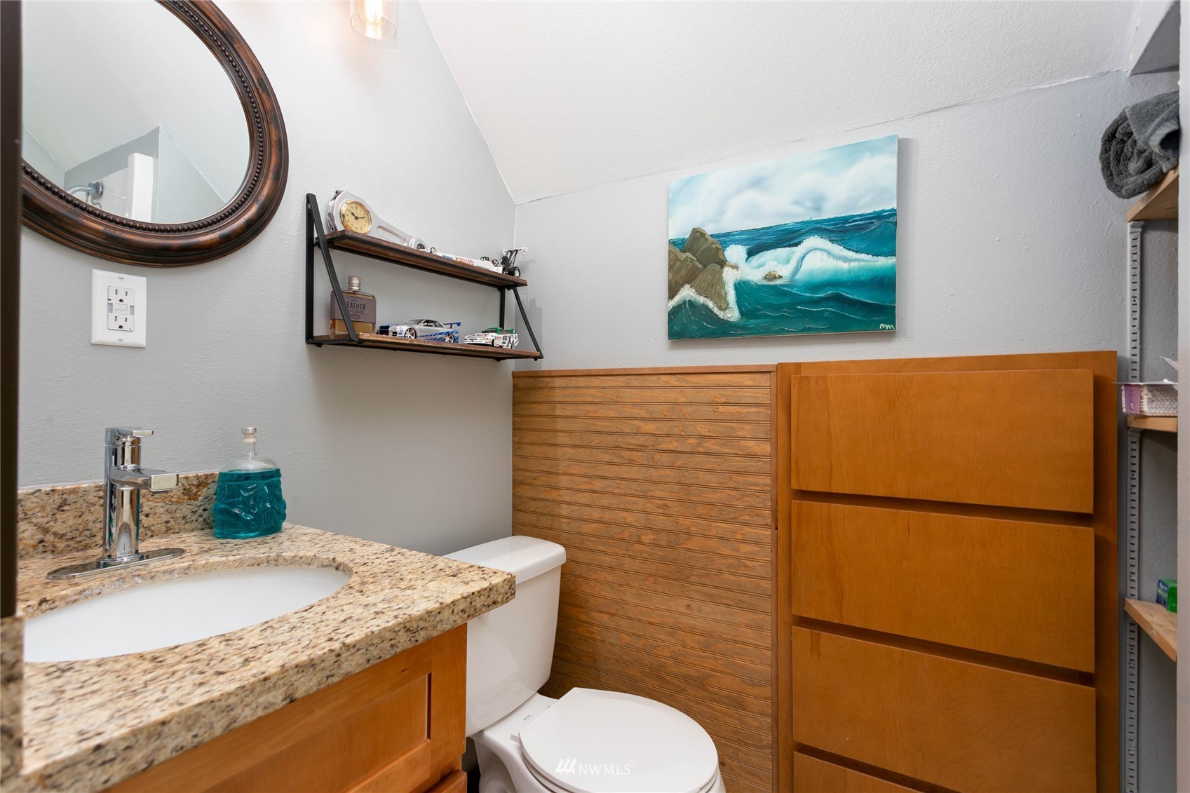 15722 240th Street East Graham, WA 98338 - Photo 20 of 40 a bathroom with a granite countertop toilet sink and mirror