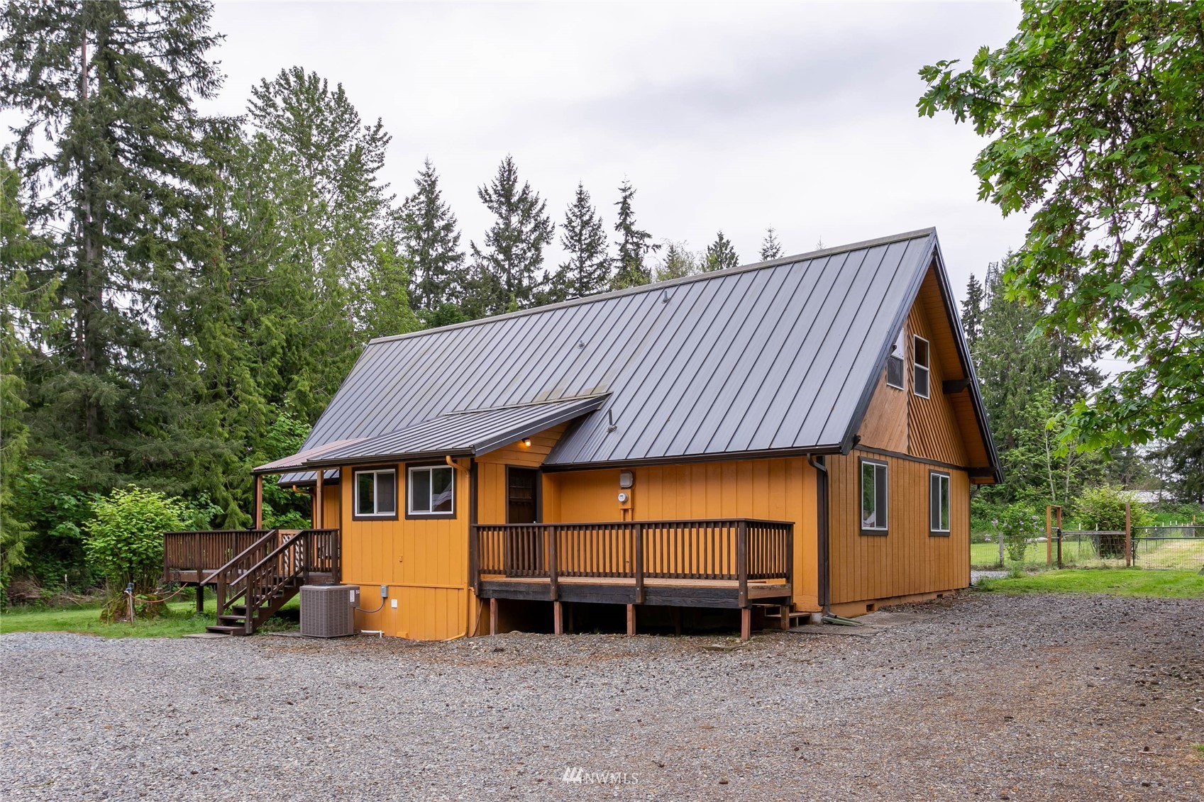 15722 240th Street East Graham, WA 98338 - Photo 2 of 40 a view of a house with a yard and sitting area
