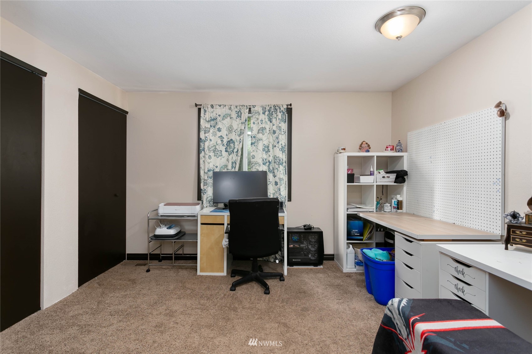 15722 240th Street East Graham, WA 98338 - Photo 23 of 40 a view of a workspace with furniture and a window