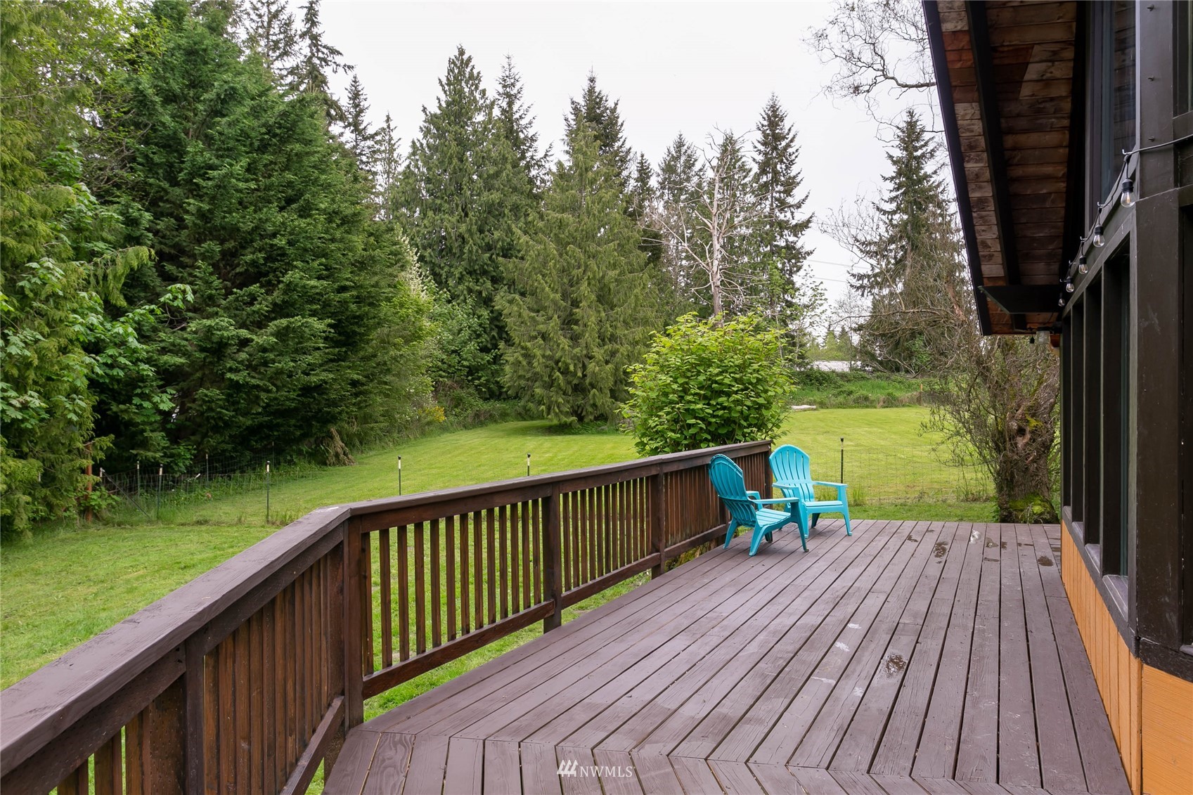 15722 240th Street East Graham, WA 98338 - Photo 28 of 40 a view of a deck with wooden floor and fence next to a yard