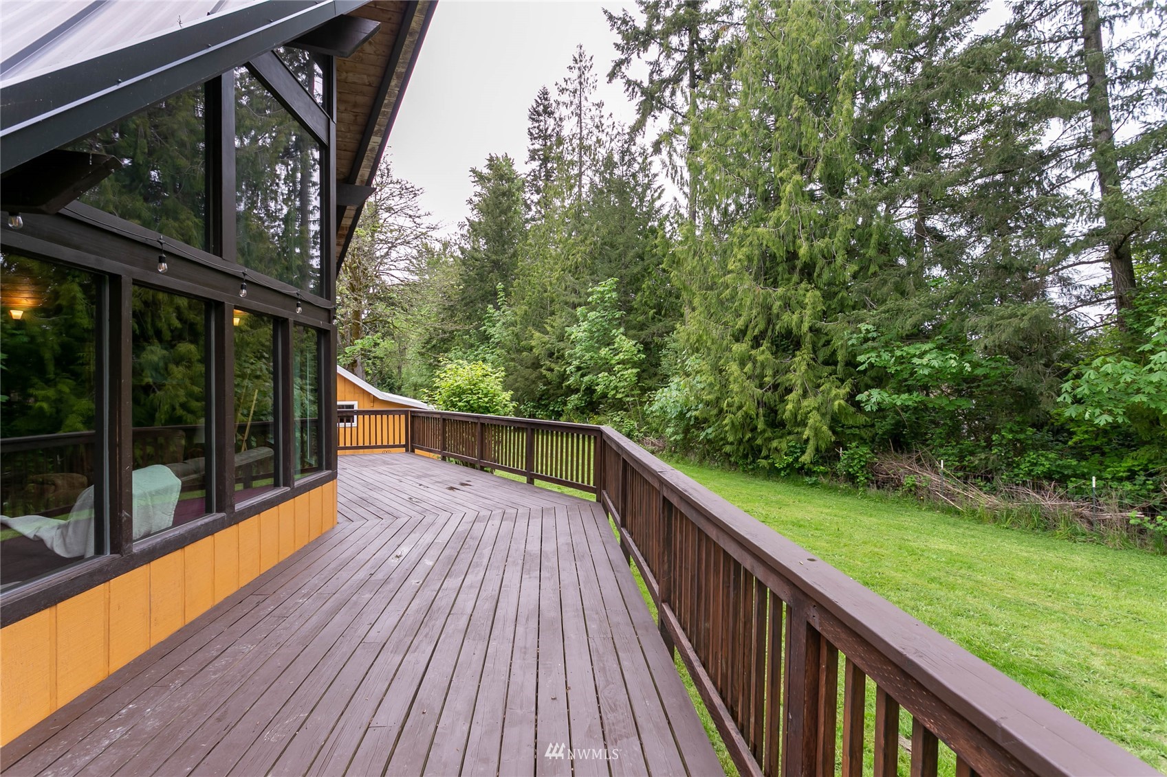 15722 240th Street East Graham, WA 98338 - Photo 29 of 40 a view of balcony with wooden floor and fence