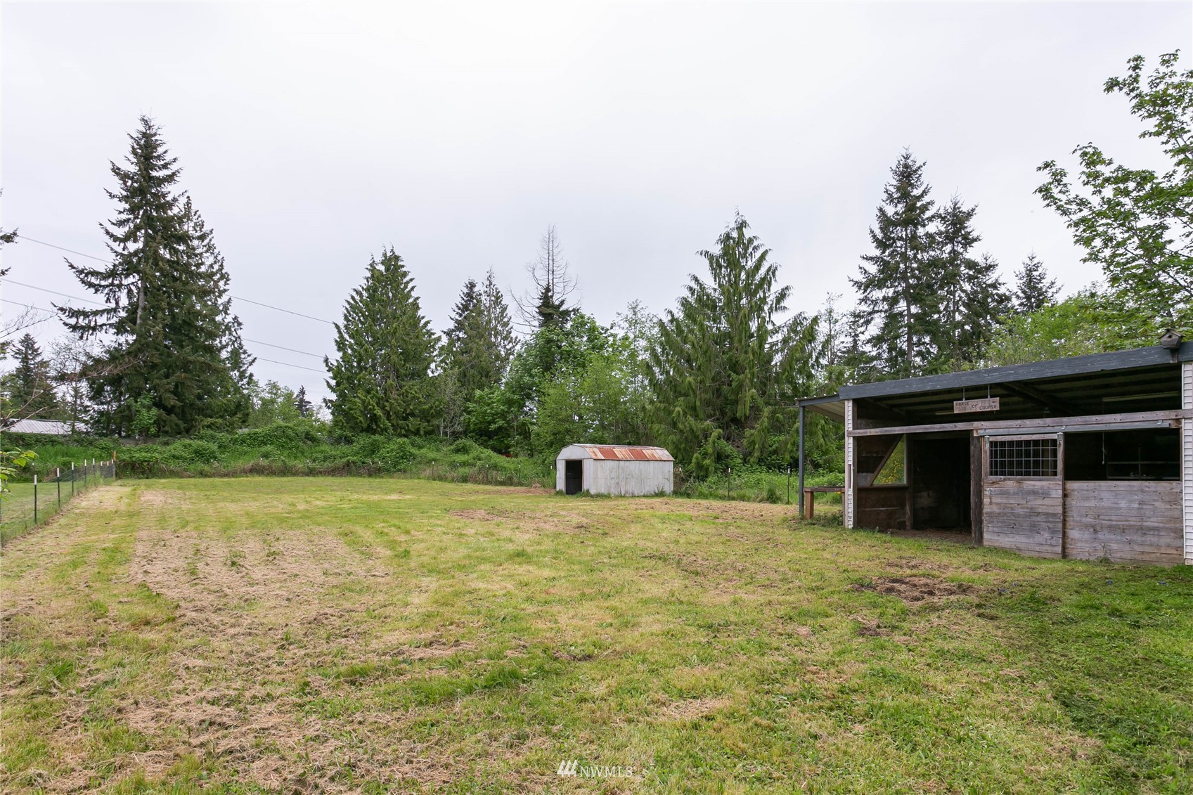 15722 240th Street East Graham, WA 98338 - Photo 30 of 40 a view of a house with a backyard and a yard