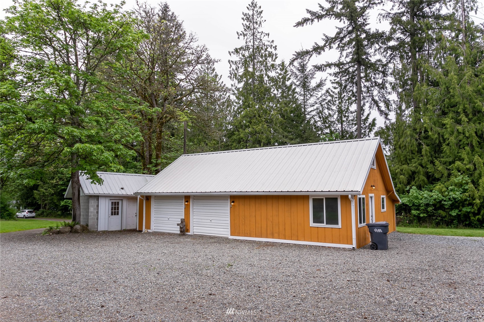15722 240th Street East Graham, WA 98338 - Photo 3 of 40 a view of a house with a yard and large tree
