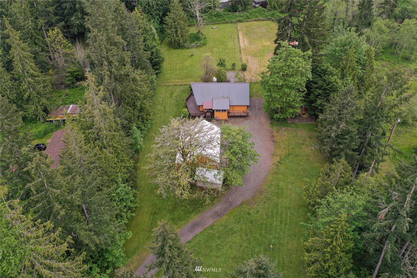 15722 240th Street East Graham, WA 98338 - Photo 33 of 40 an aerial view of a house with a yard and lake view