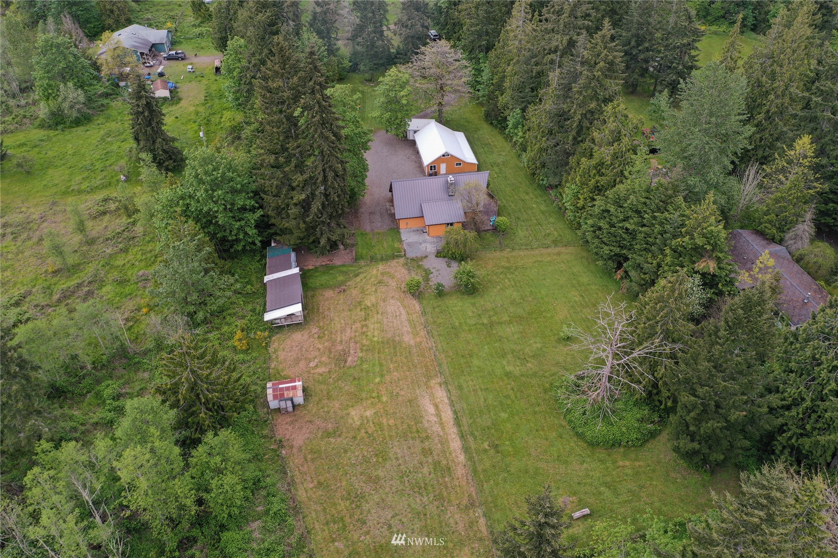 15722 240th Street East Graham, WA 98338 - Photo 34 of 40 an aerial view of a house with a yard basket ball court and outdoor seating