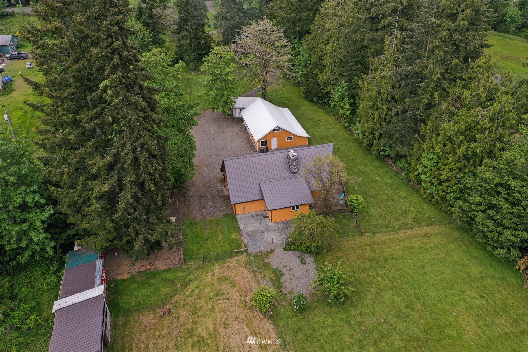 15722 240th Street East Graham, WA 98338 - Photo 36 of 40 an aerial view of a house with a yard and trees