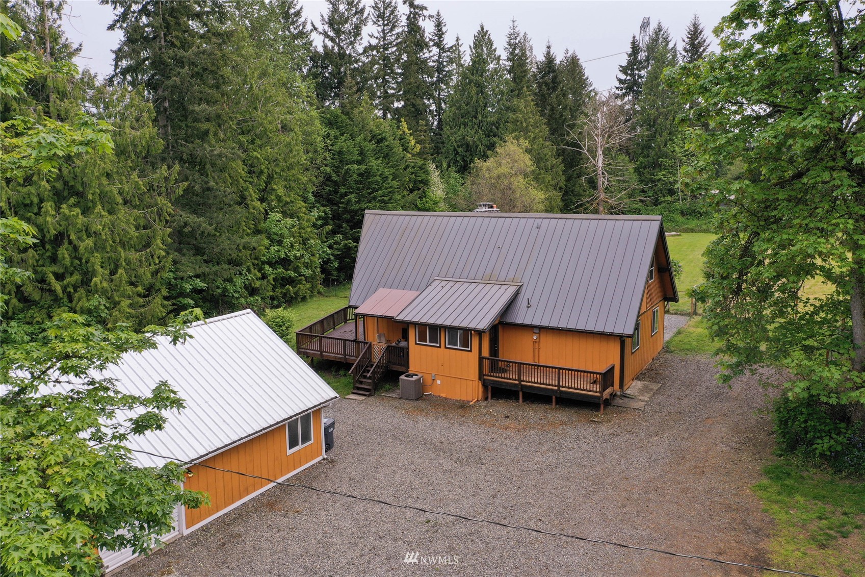 15722 240th Street East Graham, WA 98338 - Photo 40 of 40 a view of a house with a yard and sitting area