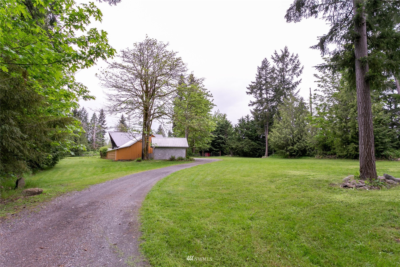 15722 240th Street East Graham, WA 98338 - Photo 4 of 40 a backyard of a house with lots of green space
